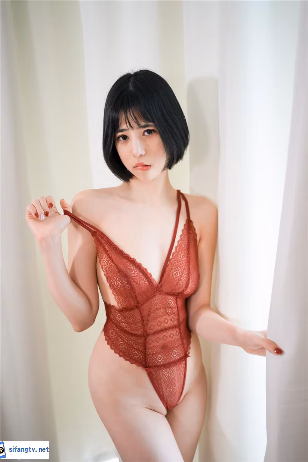 Chinese model posing in stylish red outfit