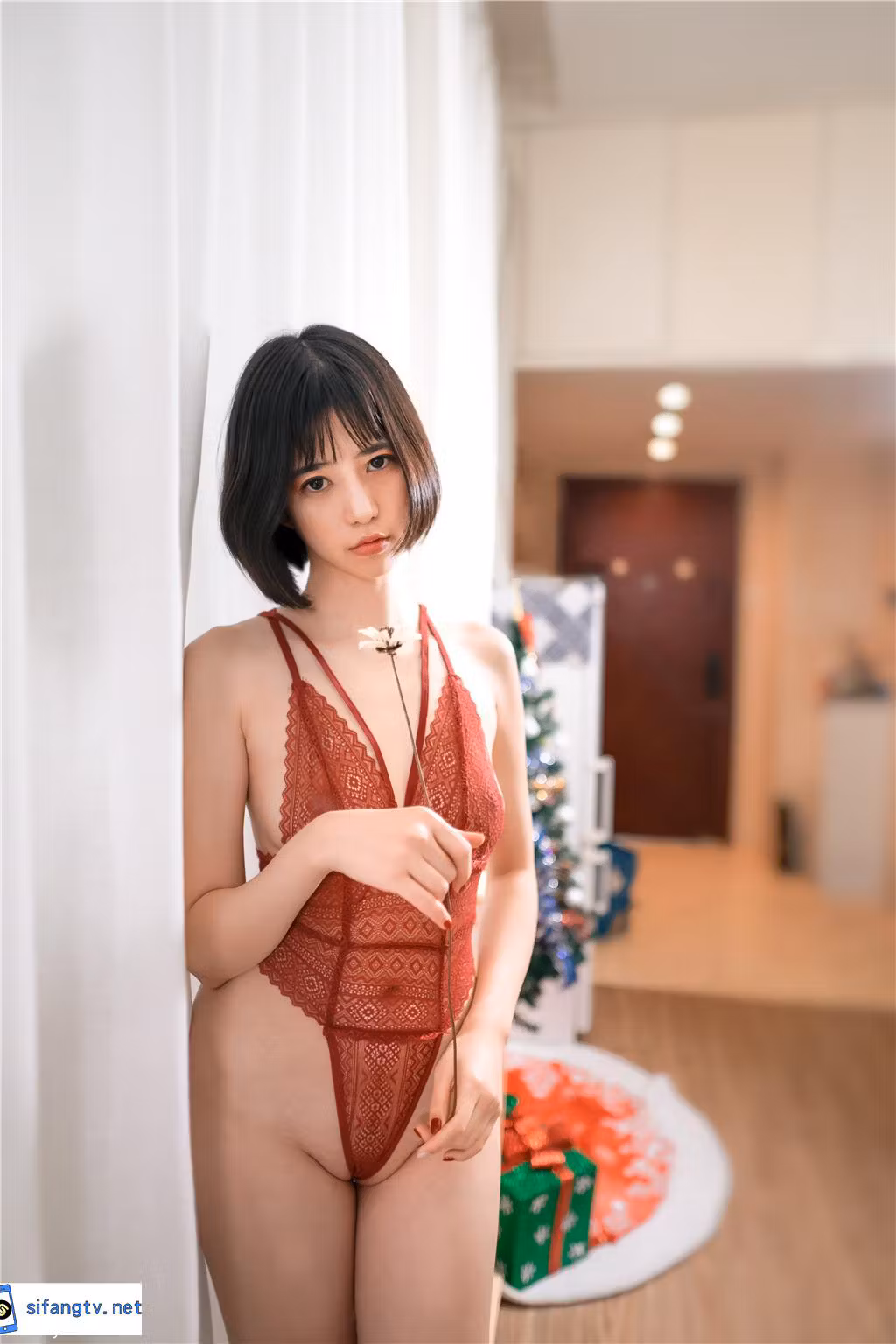 Chinese model posing in stylish red outfit