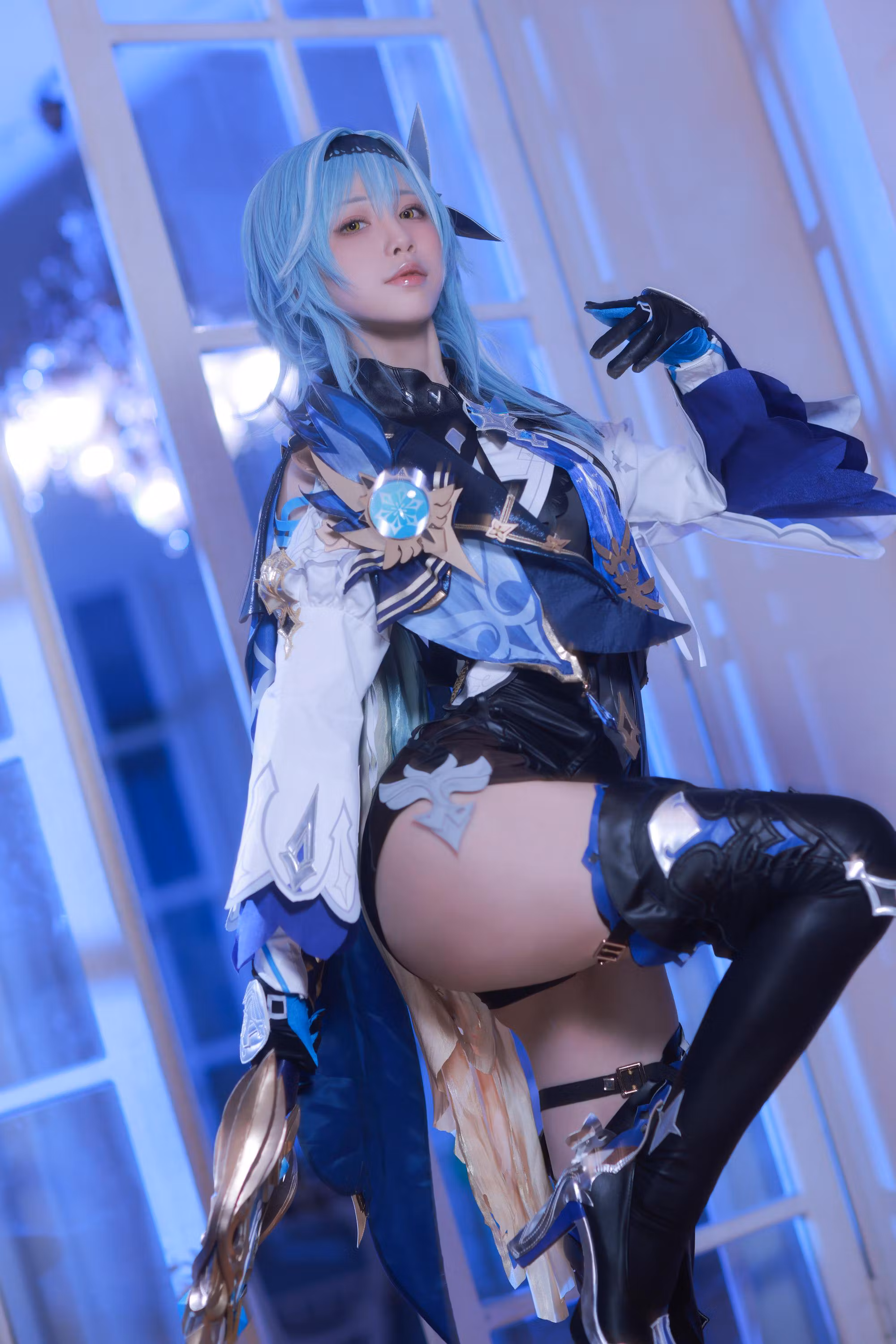 Cosplay model posing as Eula character studio shoot